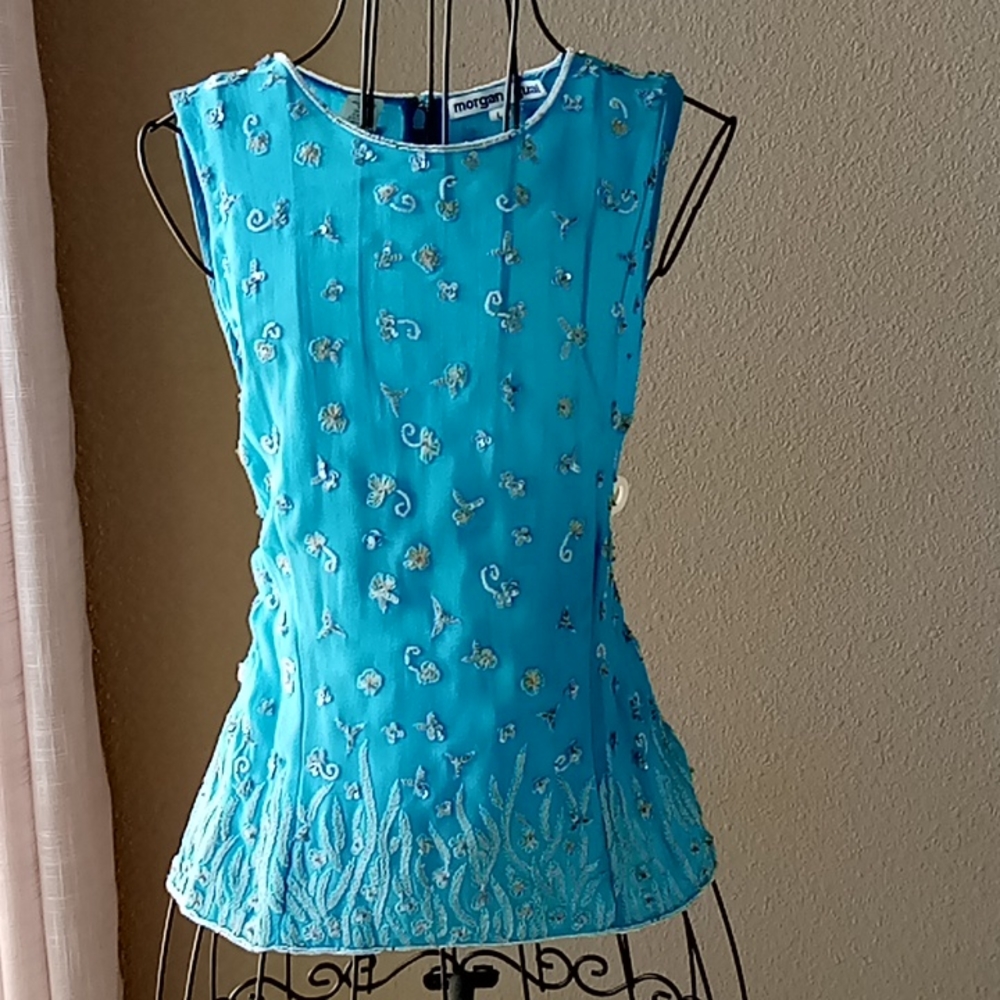 Ocean blue, 100% natural silk, lining is of viscose. Beaded accents.